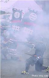 The procession begins with a rifle salute